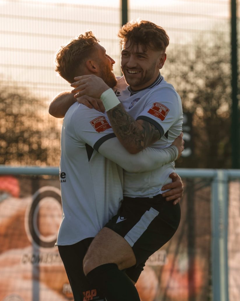 Feltham celebrates with goalscorer Adams